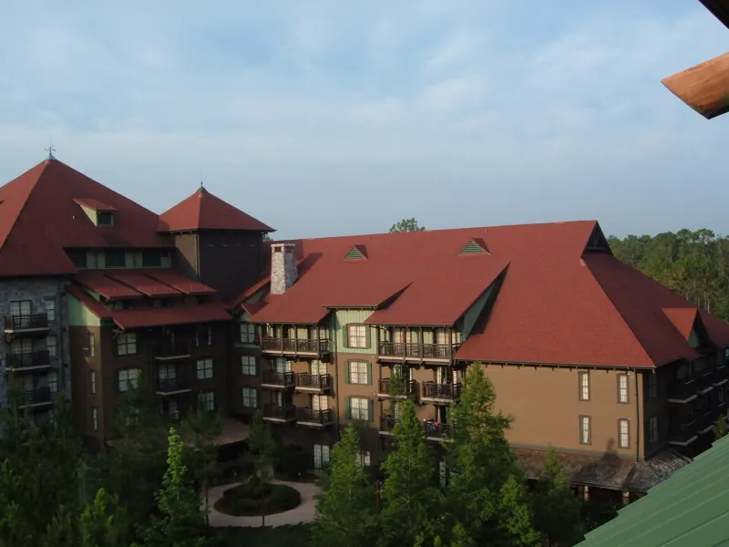 The red-roofed Boulder Ridge Villas building at Disney's Wilderness Lodge, seen from above the pine trees