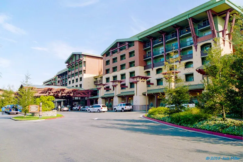 The Craftsman-style front entrance of Disney's Grand Californian Hotel & Spa, with timber-trimmed wings and its driveway