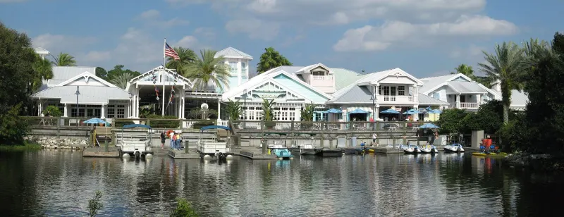 Old Key West's pastel, tin-roofed buildings and marina across the water, framed by palm trees