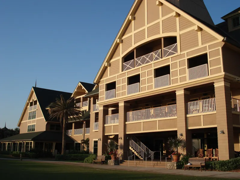 The Inn at Disney's Vero Beach Resort, a gabled Florida-style building with balconies, in warm late-afternoon light